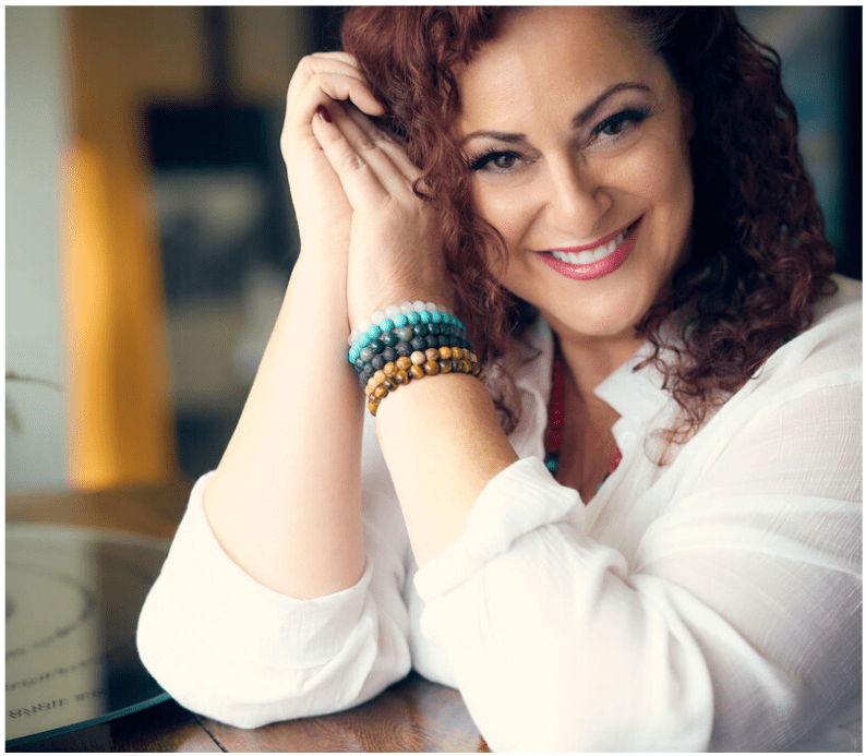 Smiling woman in white blouse