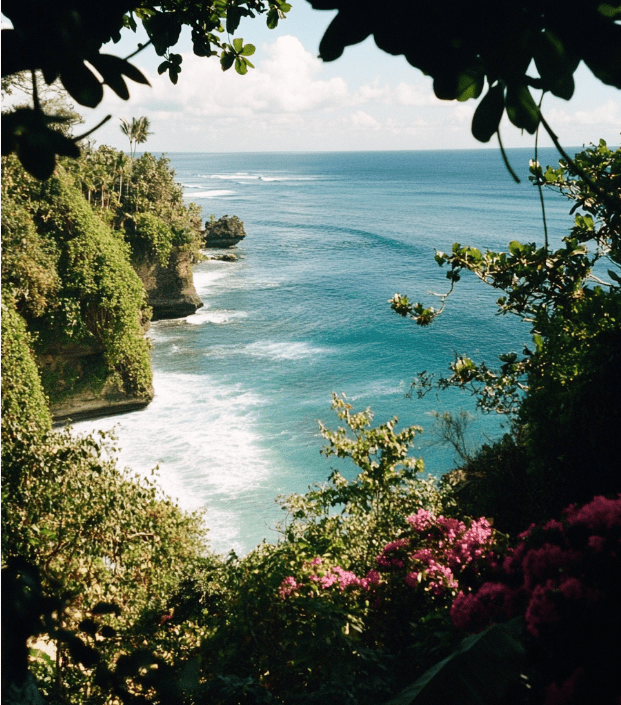 Tropical coastline with vibrant plants and sea.